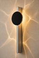 Applique murale à effet de lumière en inox