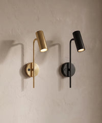 Les deux finitions de l'applique liseuse orientable, dorée et noire