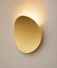 Applique murale forme galet en aluminium or brossé, halo de lumière au-dessus et au-dessous