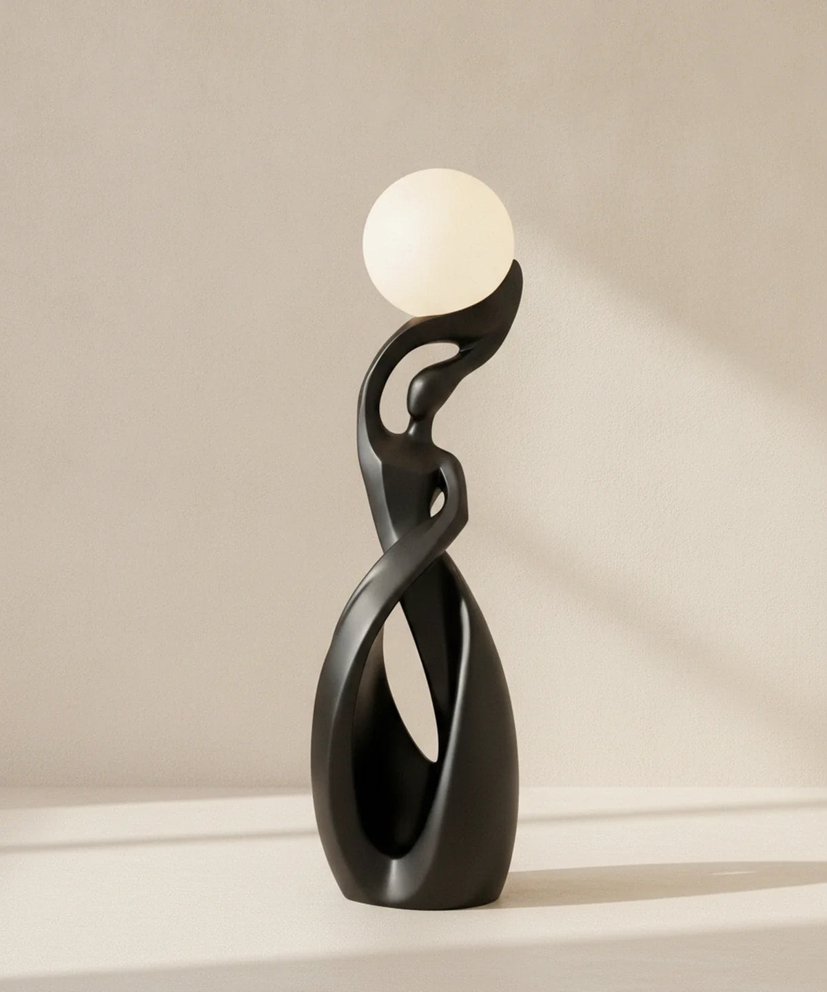 Lampadaire sculpture finition noir mat, sphère lune allumée, hauteur 82 cm