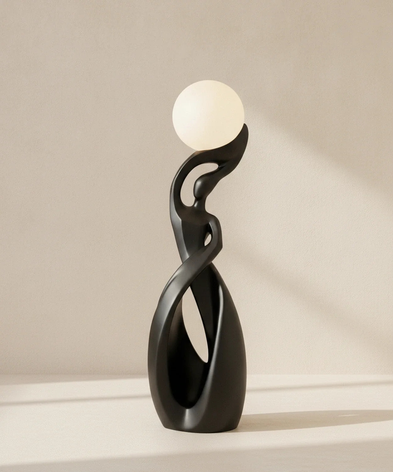 Lampadaire sculpture finition noir mat, sphère lune allumée, hauteur 82 cm