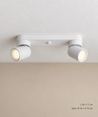 Version blanche à deux spots cylindriques inclinés sur une platine allongée